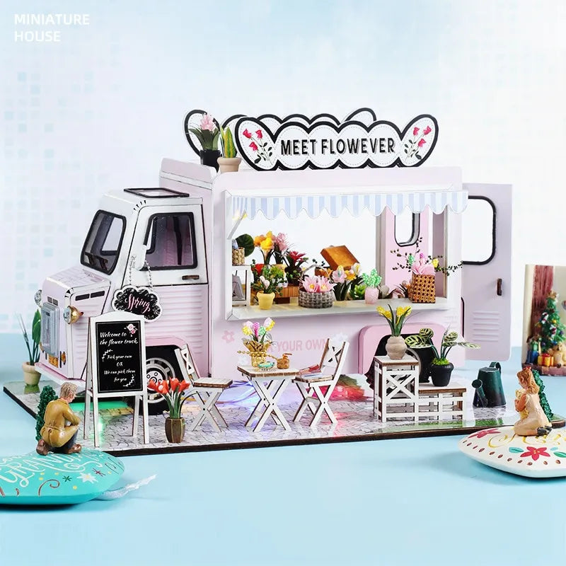 a miniature model of a pink food truck