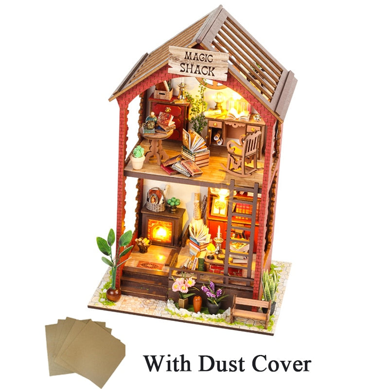 a wooden doll house with dust cover