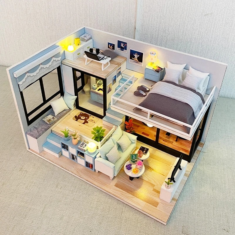 a model of a bedroom and living room in a doll house