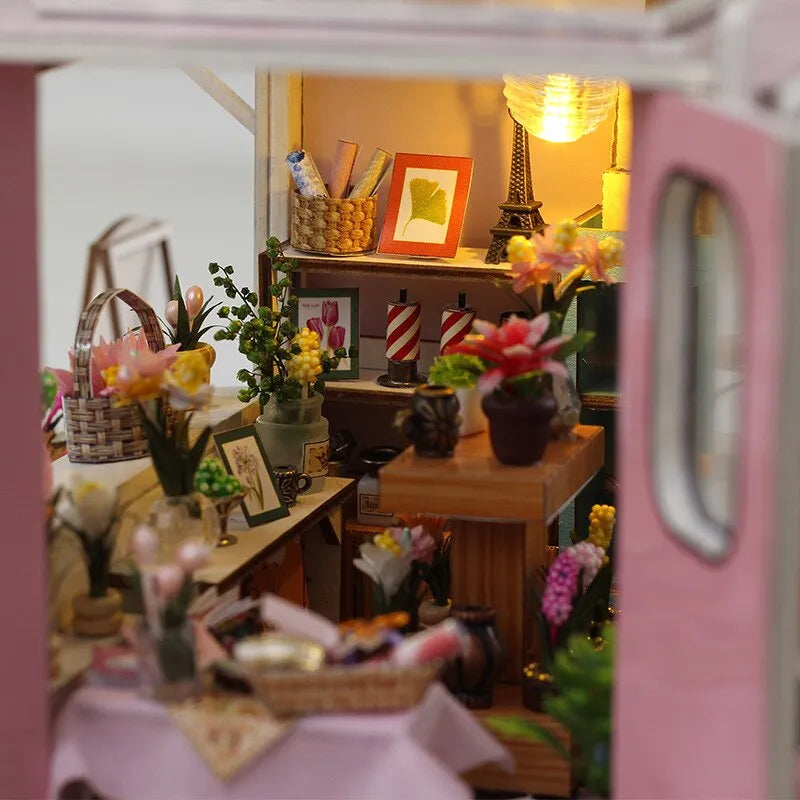 a doll house with a lot of flowers in it